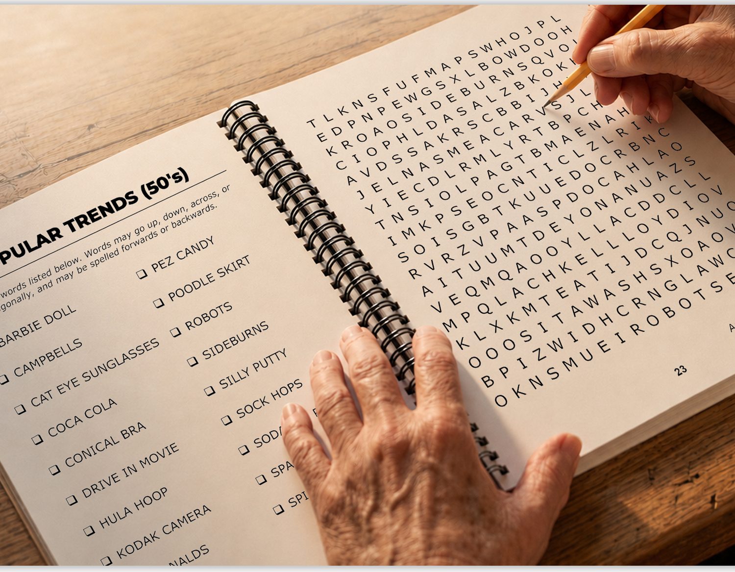 An open spiral-bound Bearwood Press puzzle book with a large grid and word list